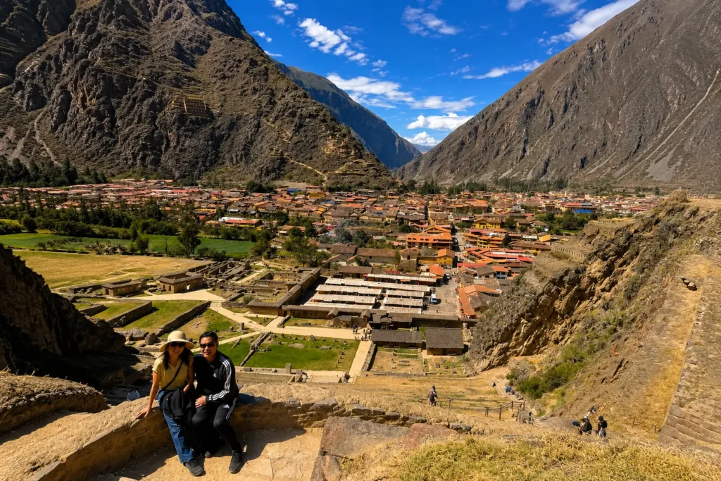 Ollantaytambo station — train to Machu Picchu departure point in the Sacred Valley with Inca ruins behind