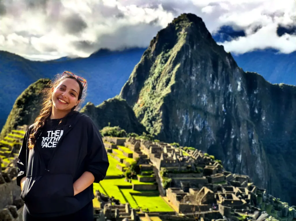Short Inca Trail to Machu Picchu — trekkers on original Inca stone path with Urubamba canyon and cloud forest