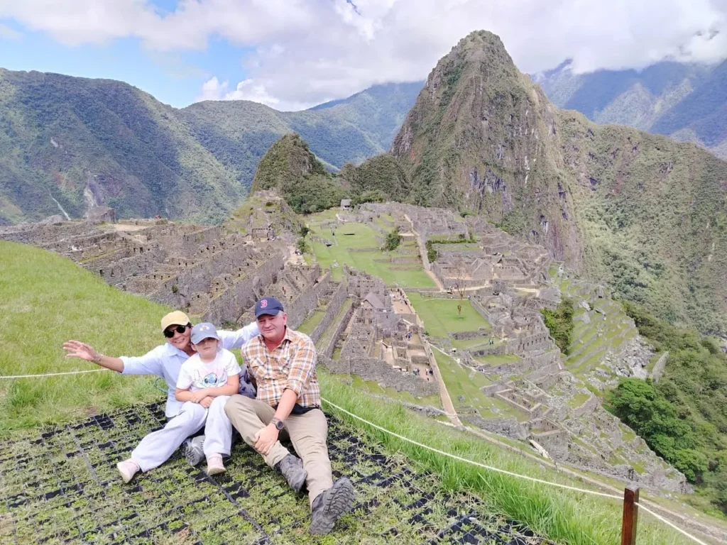 Inca Jungle Trek — group of trekkers at Machu Picchu citadel viewpoint after 4-day adventure